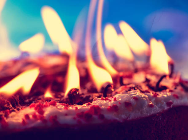 blowing out the candles of a cake