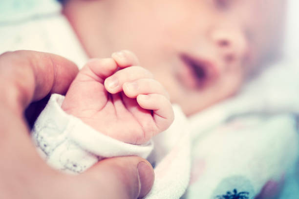 istock Doctor keeps the hand of a sick child 1126415233