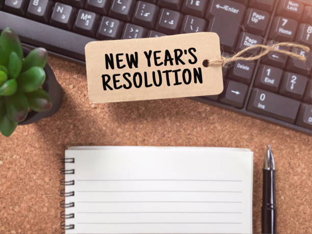 New year resolutions concept. New Year’s Resolution written on a paper tag. Vintage styled background. 2019 new year resolution stock pictures, royalty-free photos & images
