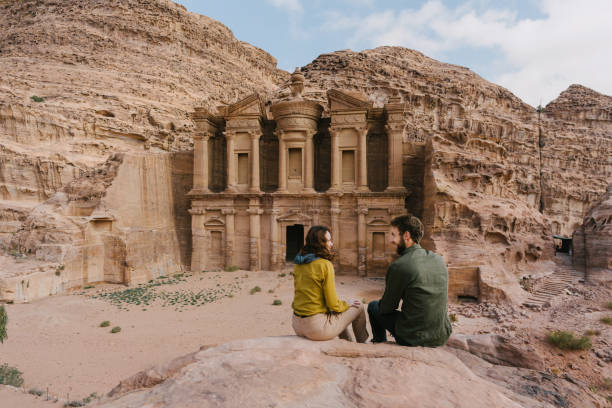 istock Couple looking at Monastery in Petra 1126417324