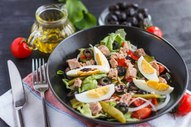 istock Nicoise salad with tuna, green beans, basil and fresh vegetables 1126419959