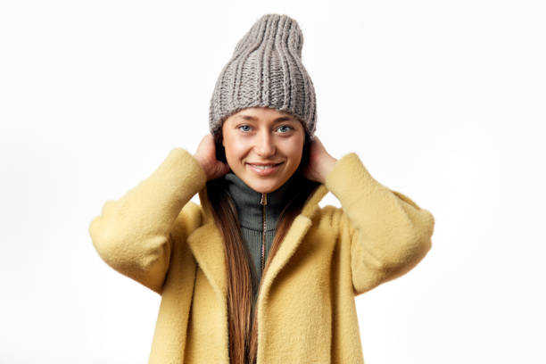 istock Young woman wearing winter coat isolated over white background 1126420579