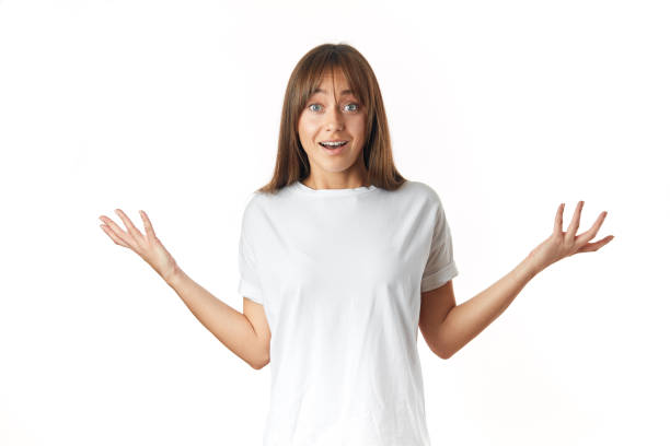 istock Surprised positive girl showing palms staring isolated over white background 1126421527