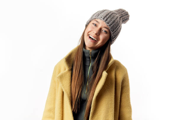 istock Young woman wearing winter coat isolated over white background 1126421552