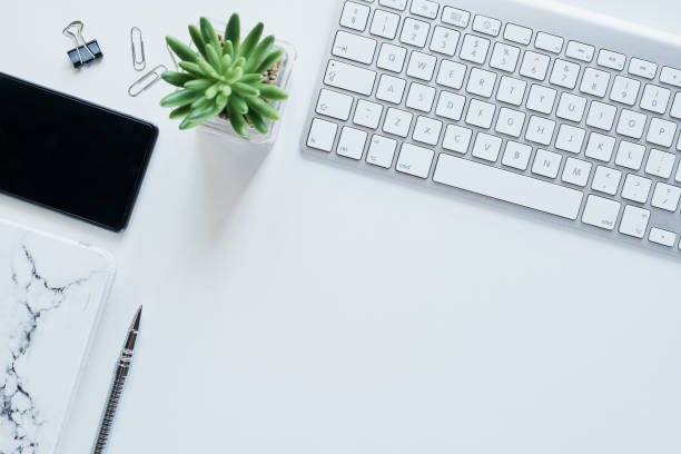 All an entrepreneur needs to stay productive Shot of various items on a work desk in a modern office neat office stock pictures, royalty-free photos & images