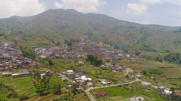 istock Mountain landscape farmlands and village Java Indonesia 1126421749