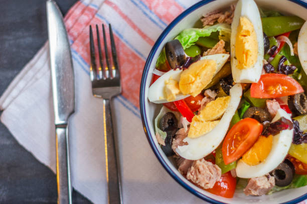 istock Nicoise salad with tuna, green beans, basil and fresh vegetables 1126422194