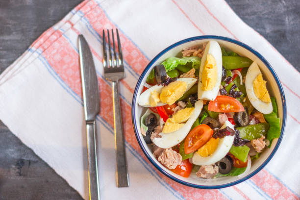 istock Nicoise salad with tuna, green beans, basil and fresh vegetables 1126422388