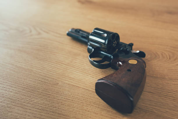 istock Revolver handgun with open cylinder 1126424215