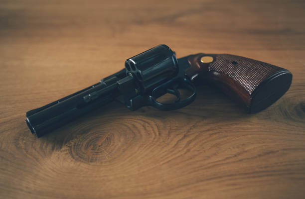istock Revolver handgun with open cylinder 1126424222