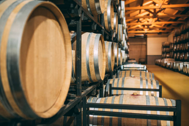 istock Wood wine barrels stored in a winery on the fermentation process 1126425850