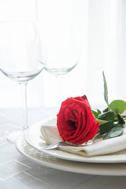 istock Valentine's day or romantic dinner with red rose. 1126426784