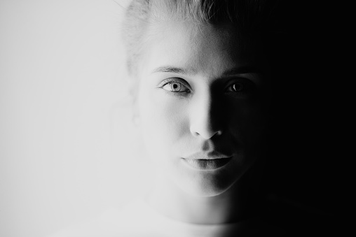 Black and white photo of a Japanese woman in sunlight.