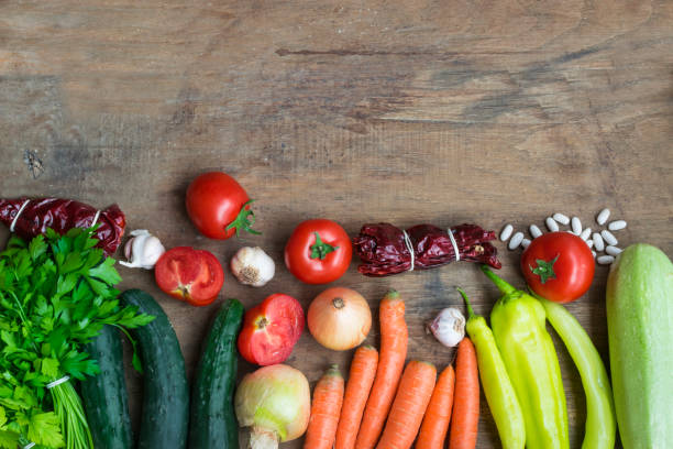 istock Various fresh vegetables from market on wooden background with space for text. High angle view 1126431043