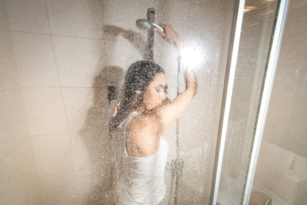 istock Hot woman taking a shower 1126432124