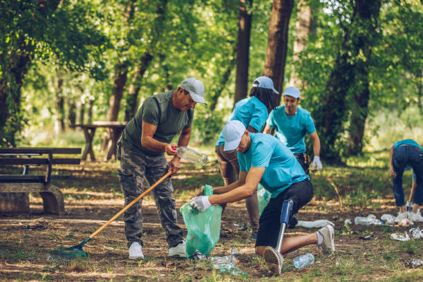 istock Group of volunteers cleaning nature 1126432318