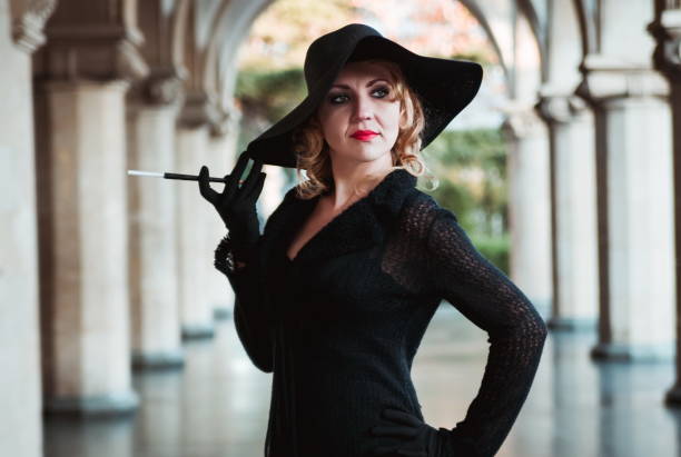 istock Woman Wearing Hat Looking Away At Corridor 1126435003