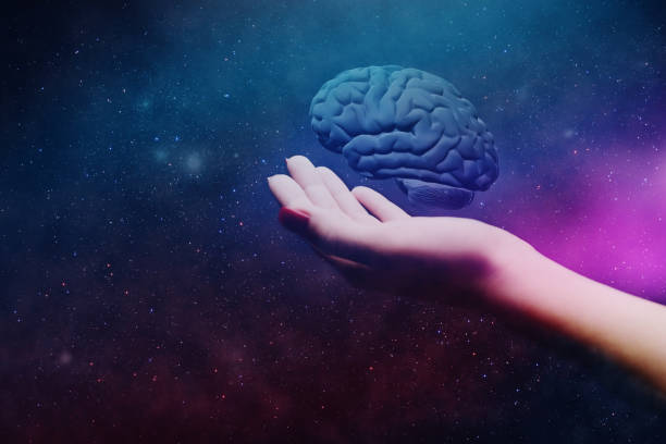 istock Woman holding brain in palm. Mixed media. 1126439635