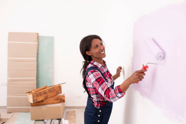 istock Woman decorating her new home. 1126439932