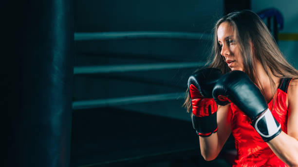 istock Boxer Hitting On Punching Bag At Gym 1126440041