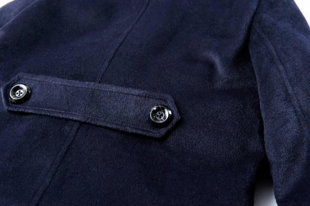 istock Dark blue trench coat back button close-up 1126441100
