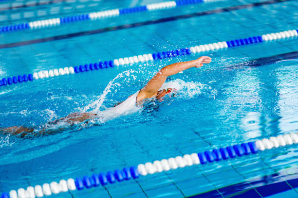 istock Female Swimmer Swimming In Pool 1126442040