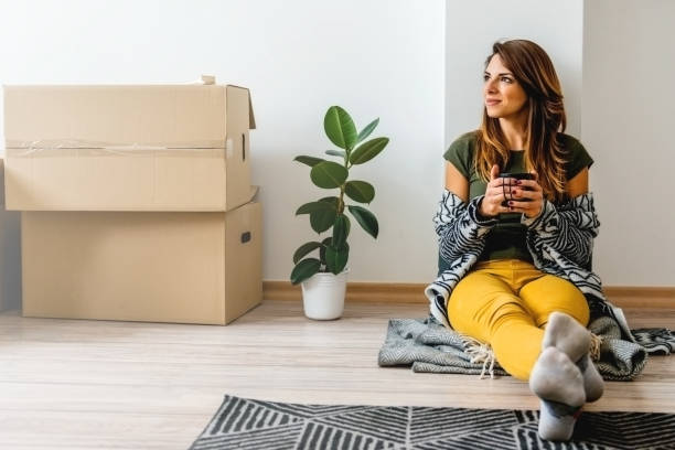 Young woman enjoying her new apartment stock photo