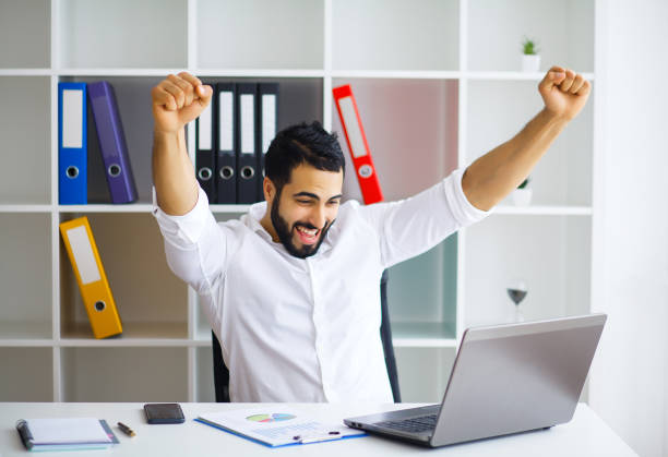 istock Happy successful businessman in a modern startup office indoors 1126442963