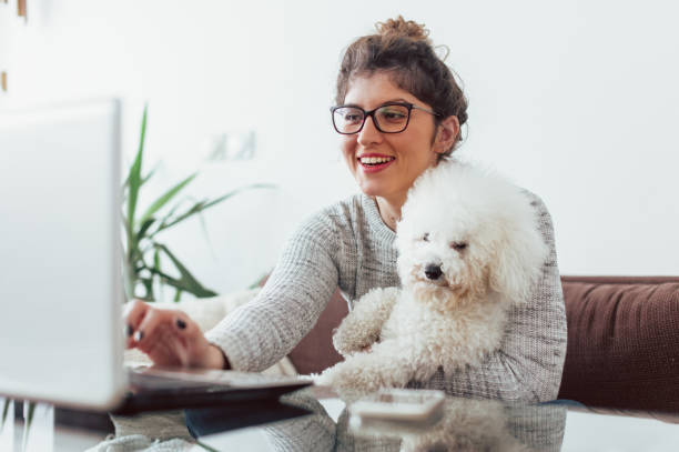 istock Woman working at home and hugging her puppy 1126444299