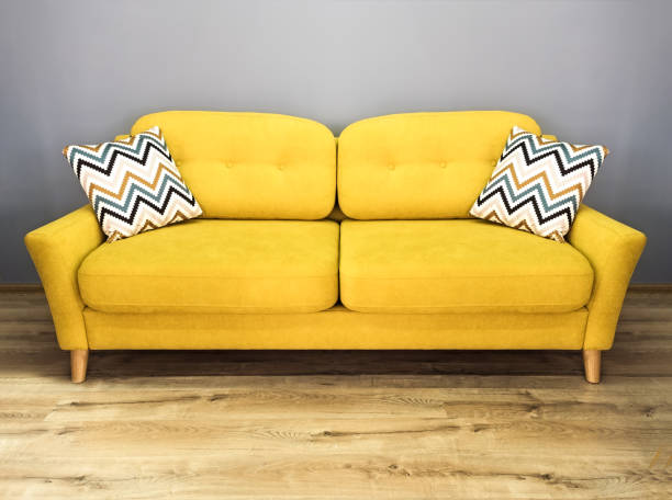 green lemon yellow sofa with pillow. soft lemon couch. modern divan in interior gray wall wooden floor - pillow cushion embroidery homewares imagens e fotografias de stock