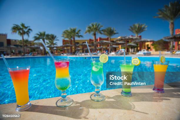 Five Cocktail Drinks By A Tropical Swimming Pool Stock Photo - Download Image Now - Poolside, Cocktail, Egypt