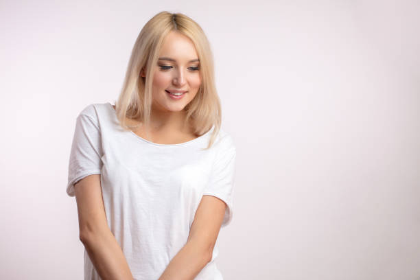istock shy blond teenager looking down 1126450837
