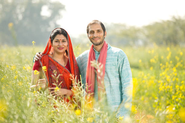 istock Rural couple standing in rapeseed field 1126451118