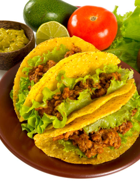 istock plate with tacos and nachos isolated on white 1126451989