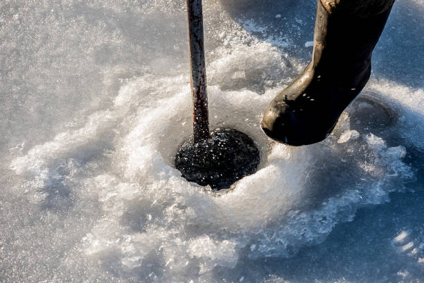 istock Fishing in the winter season under ice 1126452072