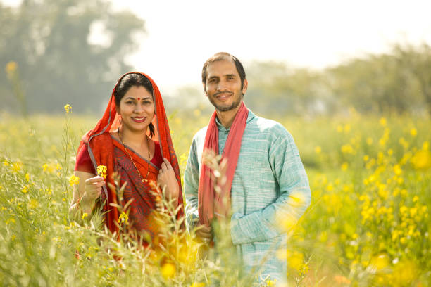 istock Rural couple standing in rapeseed field 1126453070