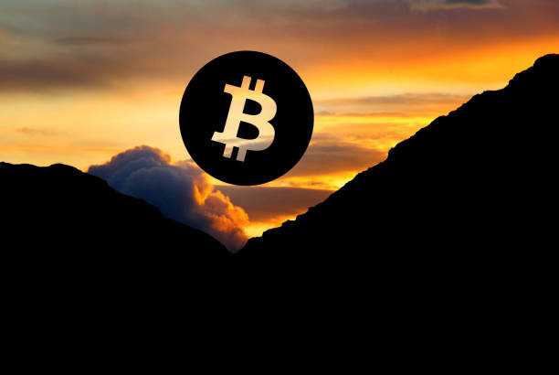 istock Concept picture of Bitcoin (-price) going down as the setting sun 1126454152