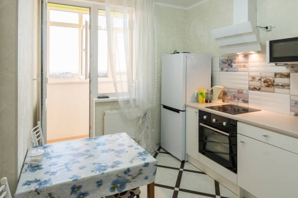 istock The interior of a small kitchen with a balcony 1126456304