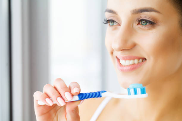 istock Woman With Beautiful Smile, Healthy White Teeth With Toothbrush. High Resolution Image 1126460633