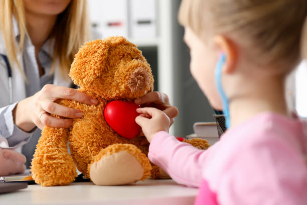 istock Little child at pediatrician reception listen 1126465232