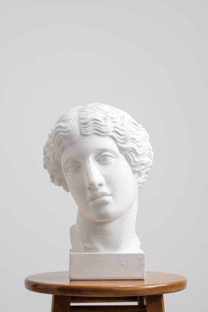 istock Plaster head, antique sculpture for learning to draw. Standing on a stool on a white background. 1126468205