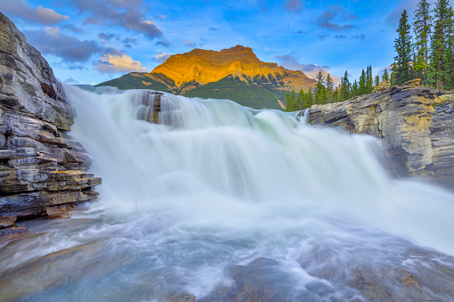 Athabasca Falls at dusk with Mount Kerkeslin in Jasper National Park