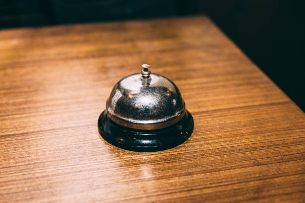 istock Rustic table bell or call bell on wooden table. For calling waiter. 1126469840