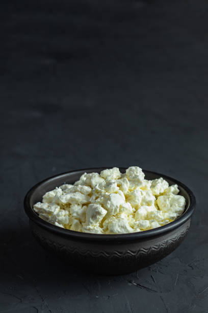 istock Homemade cottage cheese in a black ceramic bowl 1126471710