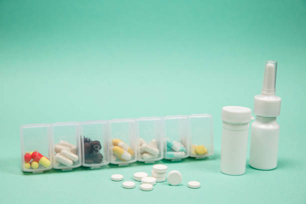 istock Assorted medical drugs and syringe on blue 1126473381