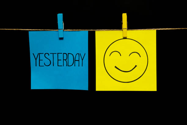 istock Copy space. Two stickers. On left a sheet inscription yesterday. On the right sheet face with smile and good nature. Emotion. 1126473495