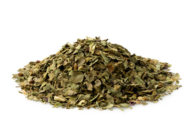 istock A pile of dried chopped basil isolated on white. 1126473714