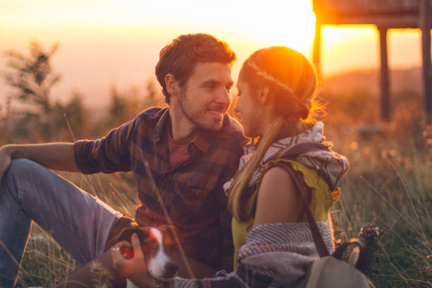 istock Couple enjoying a sunny day with dog 1126474048