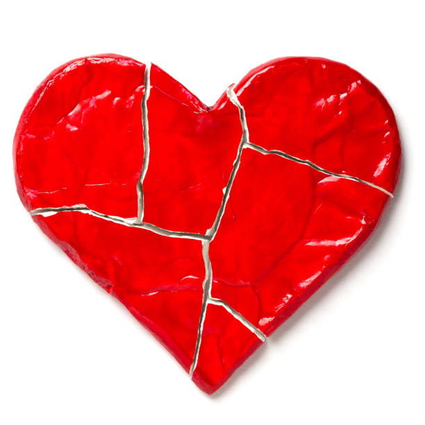 istock Red broken heart isolated on white background. Cut out 1126475968