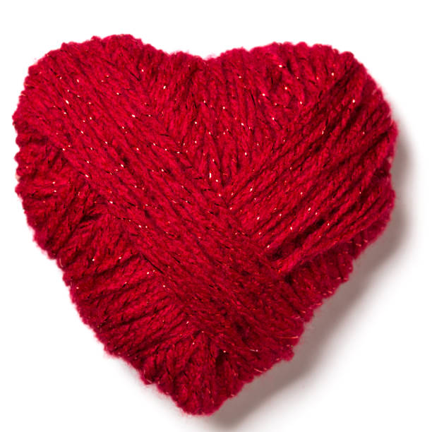 istock Handmade knitted red heart isolated on white. Cut out 1126475977
